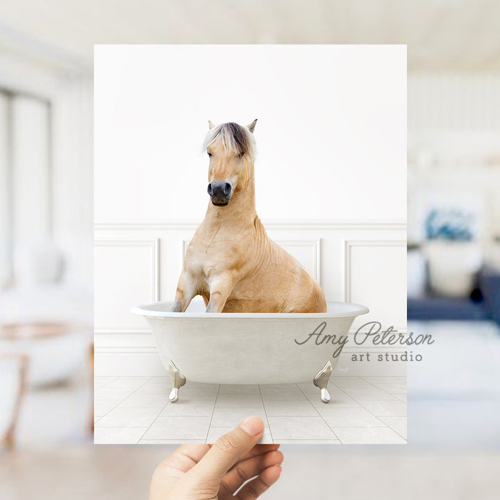 a person holding a card with a horse in a bathtub