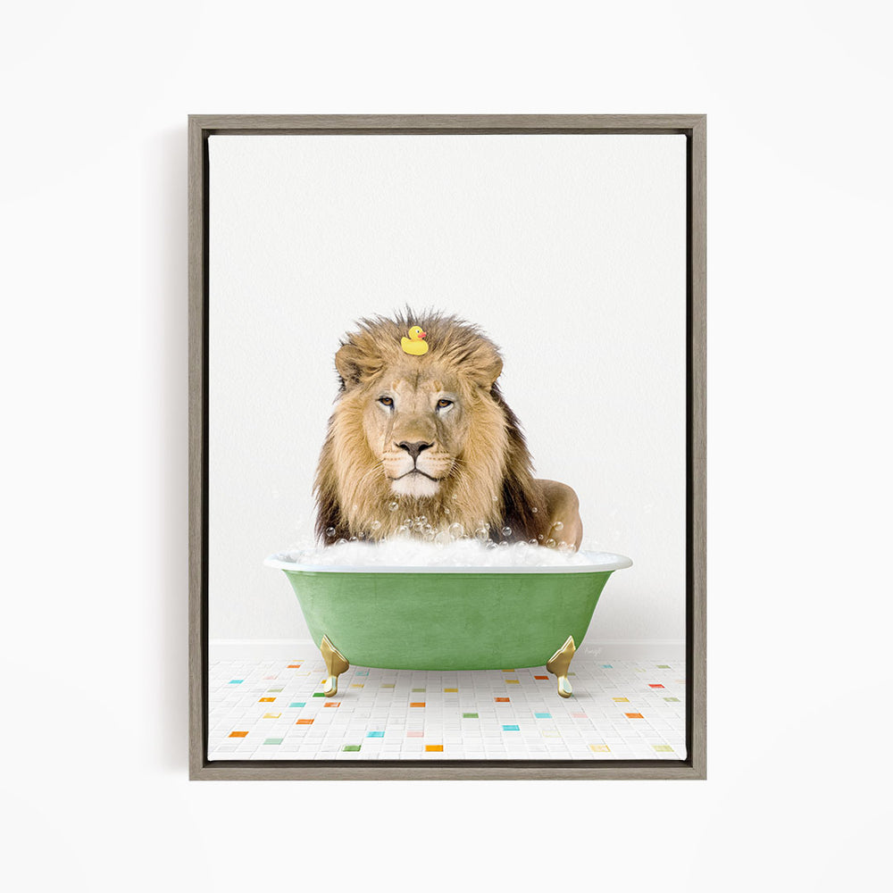 A lion is sitting in a green bathtub filled with water, with a rubber duck floating on its head.