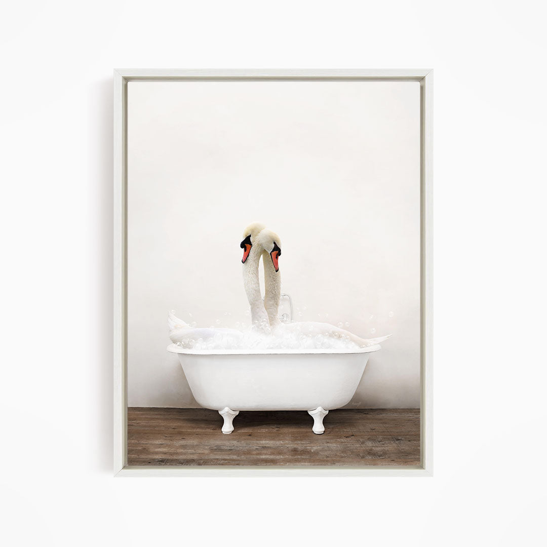 A white swan standing in a white bathtub filled with water, with bubbles around it.