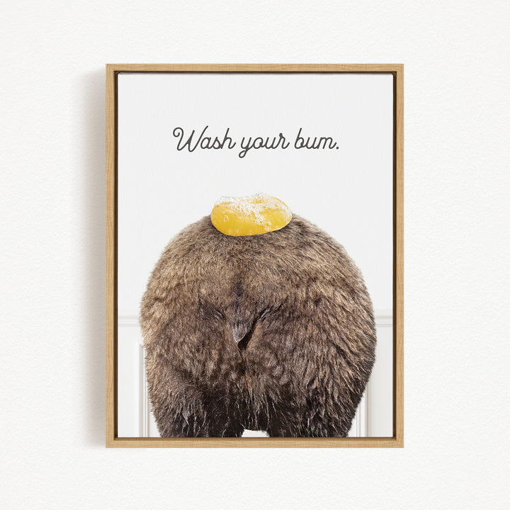 a close-up of a furry animal, possibly a bear or a similar creature, with a yellow object on its head. The text "Wash your butt" is written above the animal.
