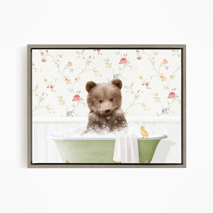 A brown bear sitting in a green bathtub filled with bubbles, with a yellow rubber duck floating nearby.