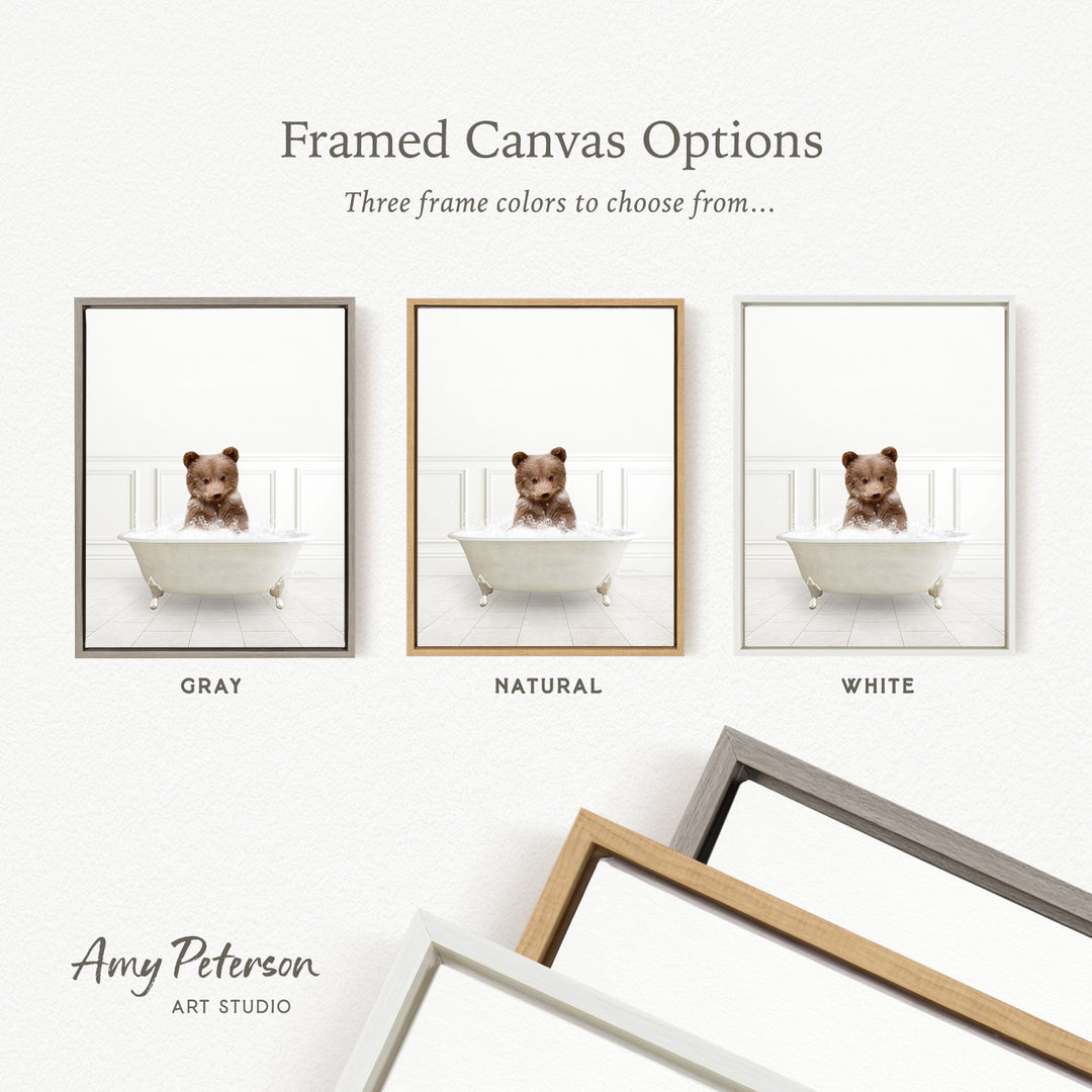three framed canvas options, each featuring a brown teddy bear sitting in a white bathtub. The options include a gray frame, a natural frame, and a white frame.