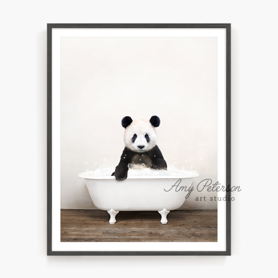 a panda bear sitting in a bath tub