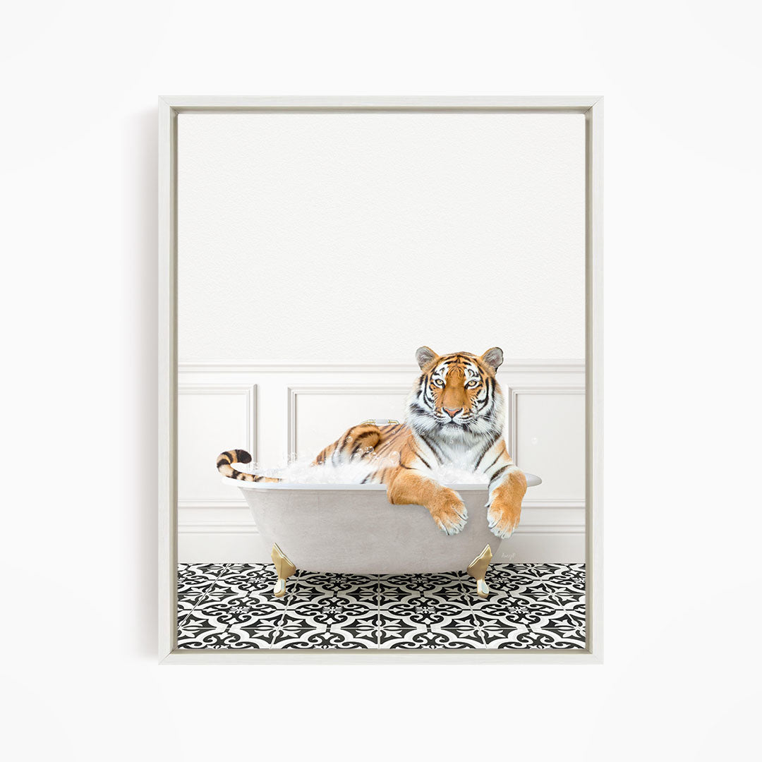 A tiger is sitting in a white bathtub filled with bubbles, relaxing and enjoying the bath.