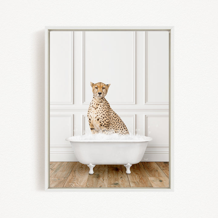 A cheetah sitting in a white bathtub filled with water, looking directly at the camera.