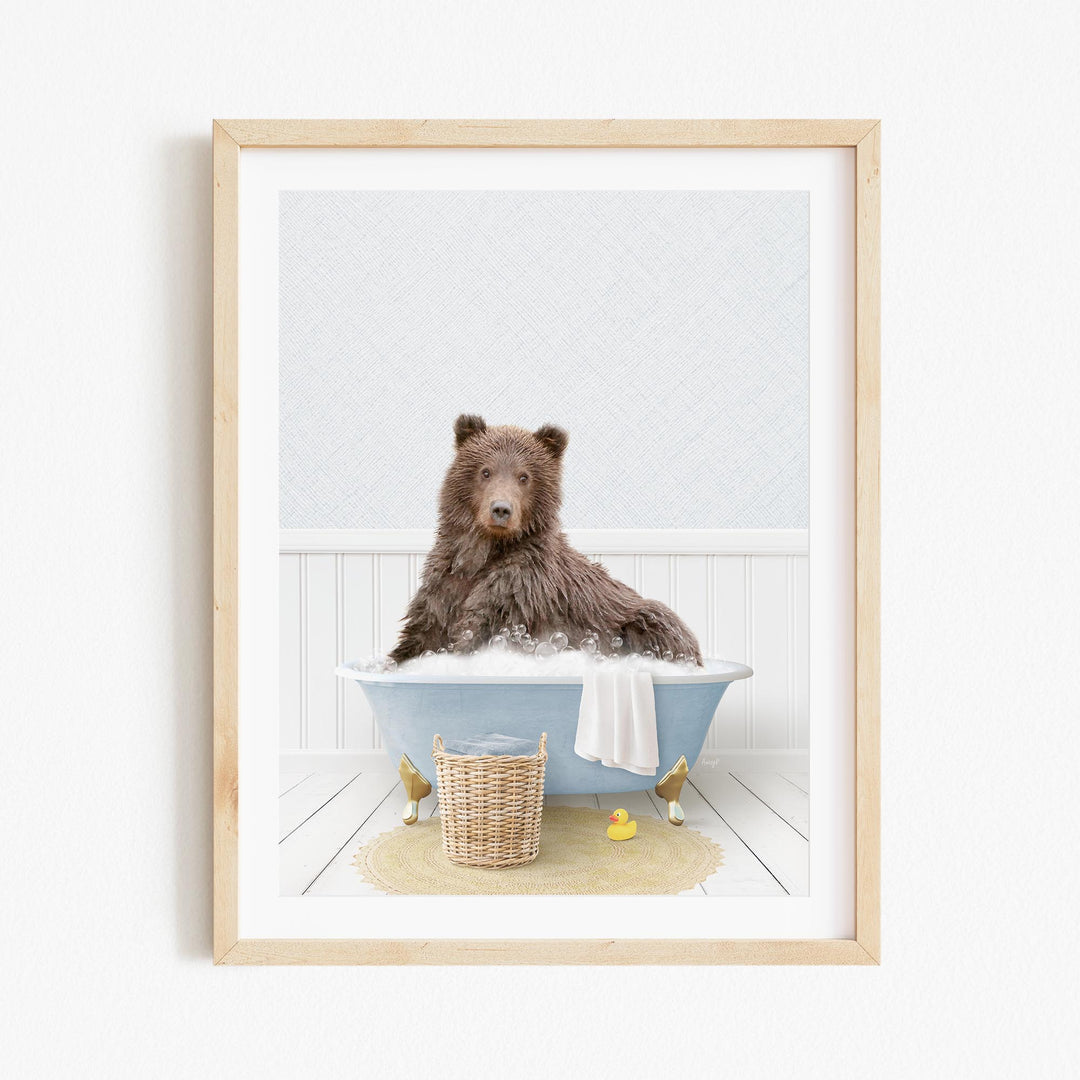 A brown bear sitting in a blue bathtub filled with bubbles, surrounded by rubber ducks and a basket.