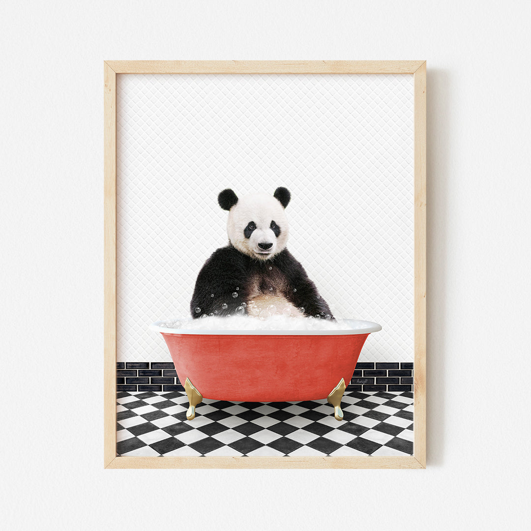 a panda bear sitting in a red bath tub