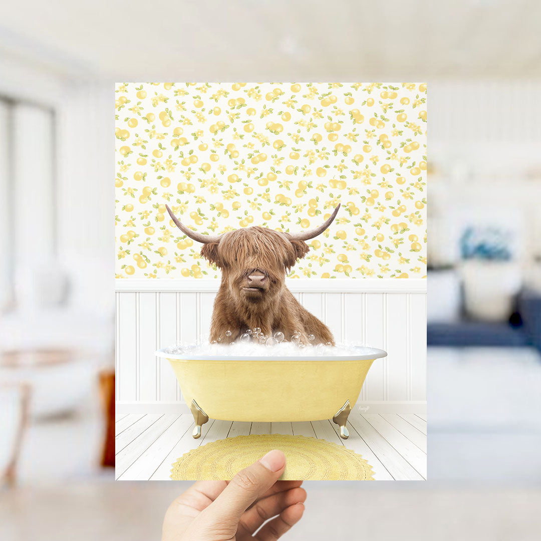 A brown cow with horns is sitting in a yellow bathtub filled with bubbles, surrounded by a yellow and white floral pattern on the wall.