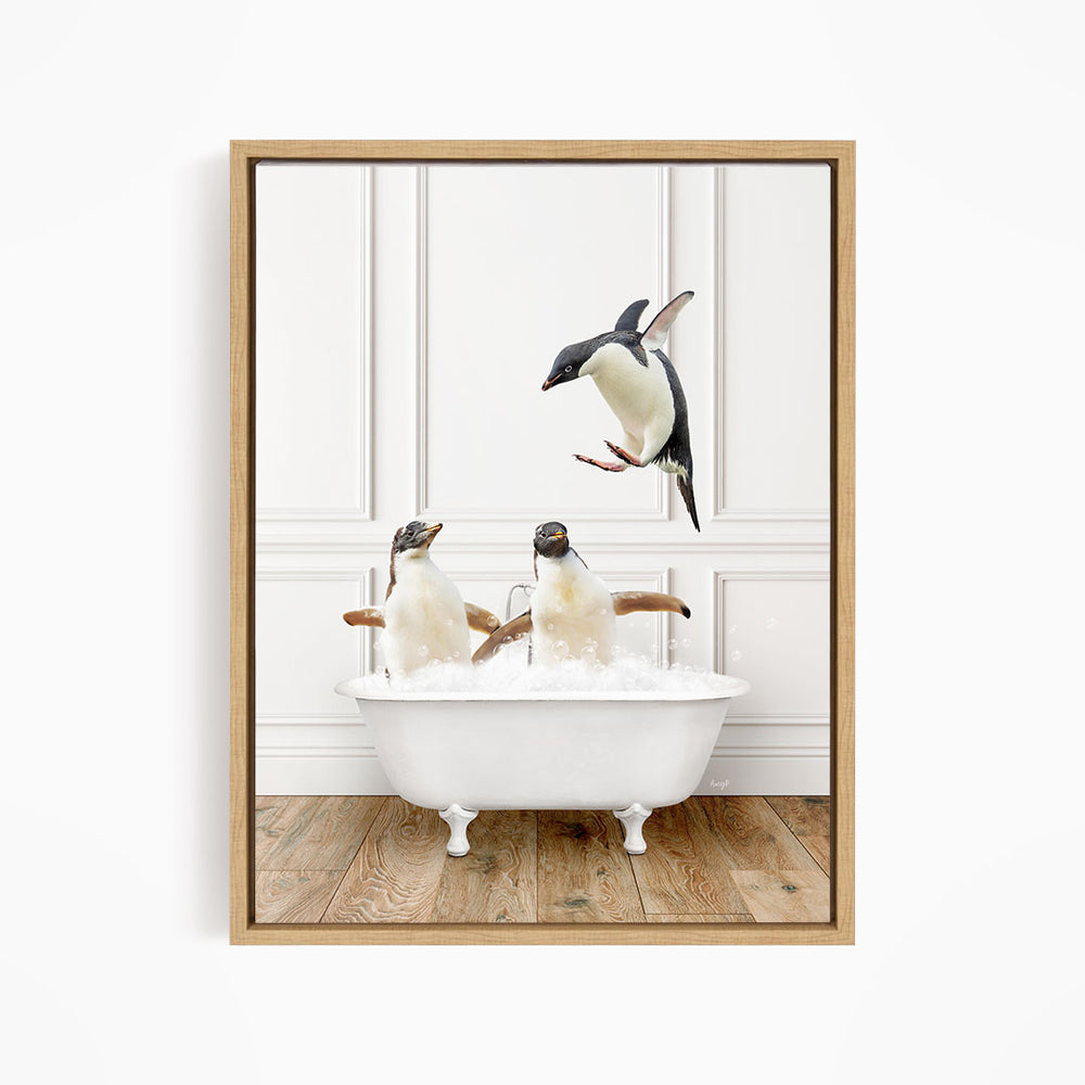 A framed image depicting two penguins sitting in a bathtub, with one penguin flying towards the other.