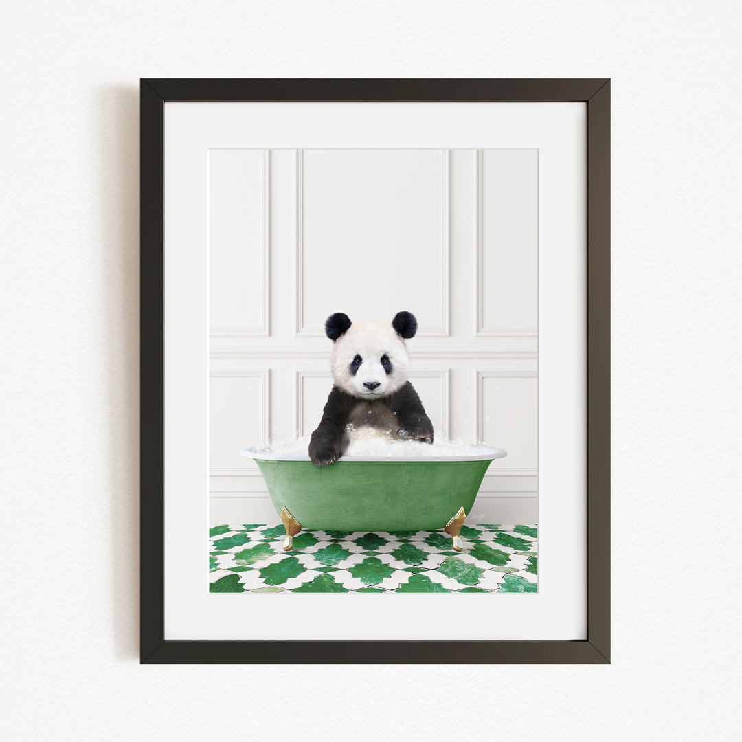 A panda bear sitting in a green bathtub filled with bubbles, surrounded by a green and white patterned rug.