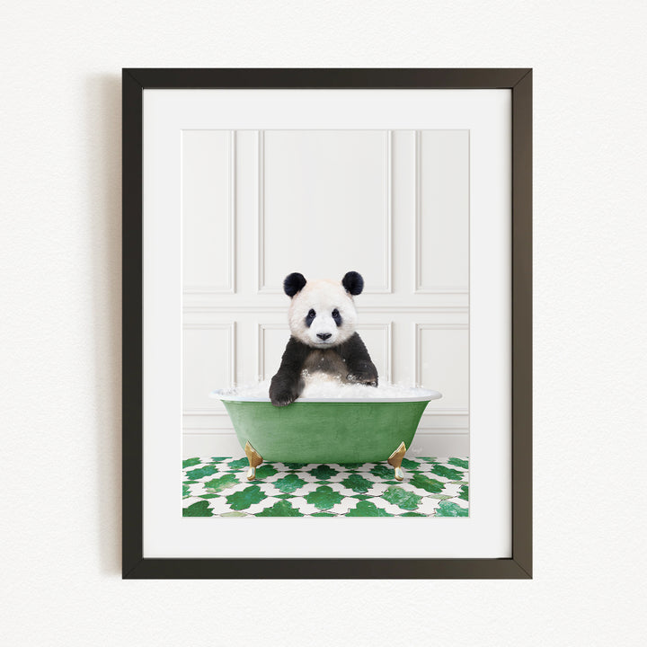 A panda bear sitting in a green bathtub filled with bubbles, surrounded by a green and white patterned rug.