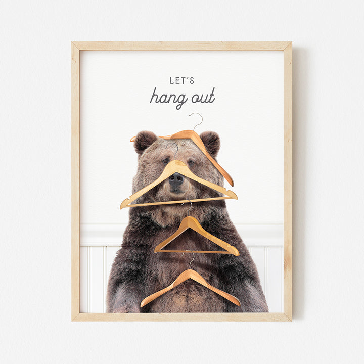 a picture of a bear with a hanger in his mouth