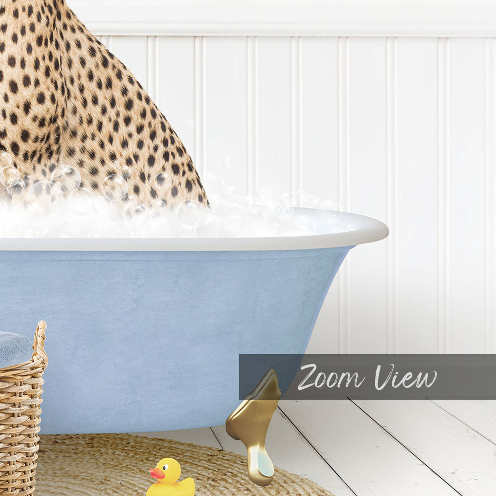 A cheetah is taking a bath in a blue tub, surrounded by a yellow rubber duck and a basket.