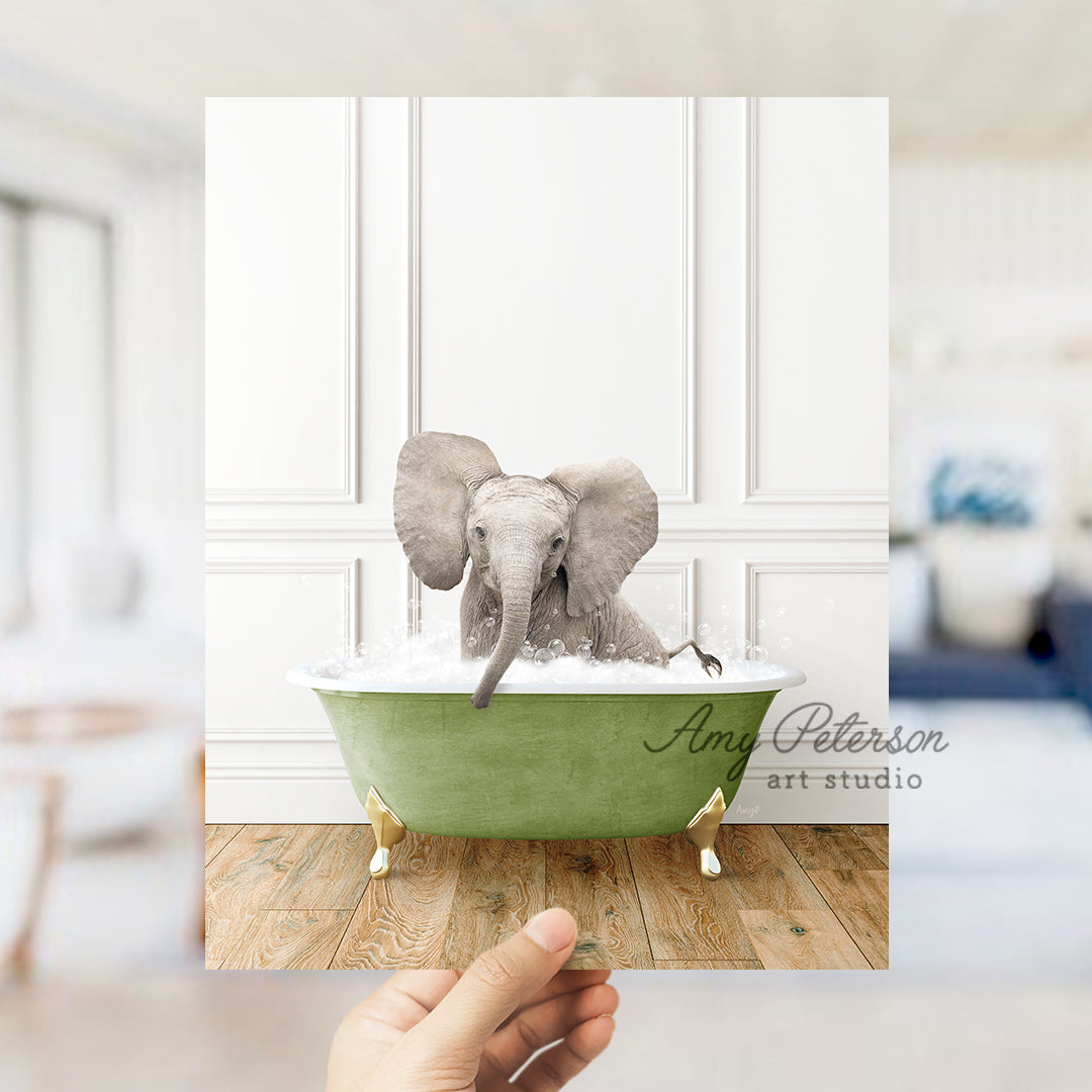 a hand holding a card with an elephant in a bathtub