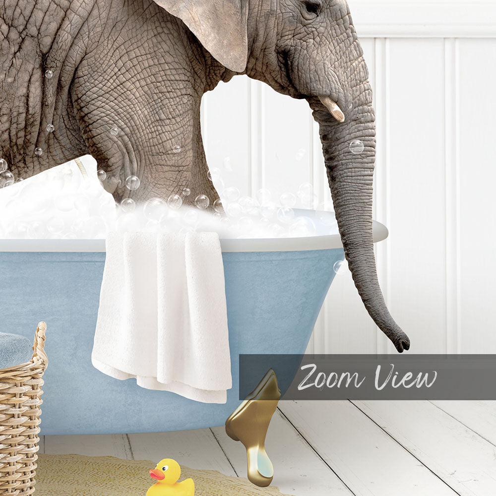 A large elephant is taking a bath in a blue tub, surrounded by bubbles and a yellow rubber duck.
