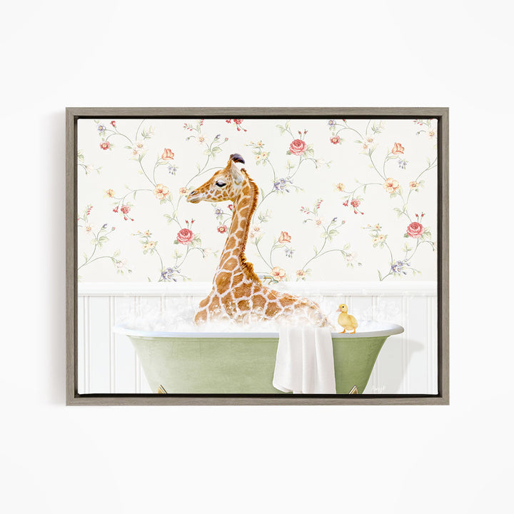 A giraffe sitting in a green bathtub filled with water, surrounded by a floral wallpaper.