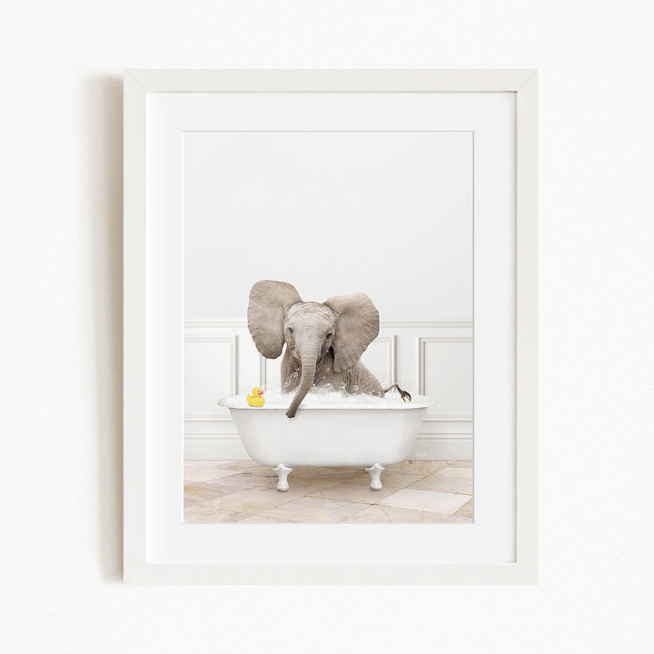 A baby elephant sitting in a white bathtub, surrounded by yellow rubber ducks.