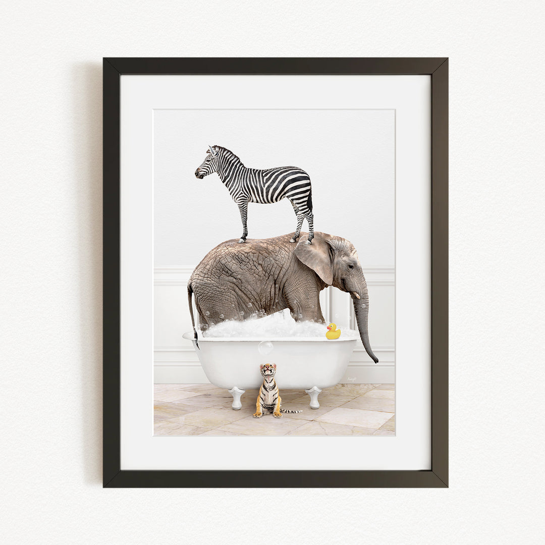 A zebra stands on the back of an elephant, which is sitting in a bathtub filled with water and bubbles, while a small tiger sits nearby.