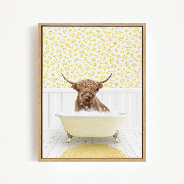 A brown cow with long horns is sitting in a white bathtub filled with bubbles, surrounded by a yellow floral pattern on the wall behind it.