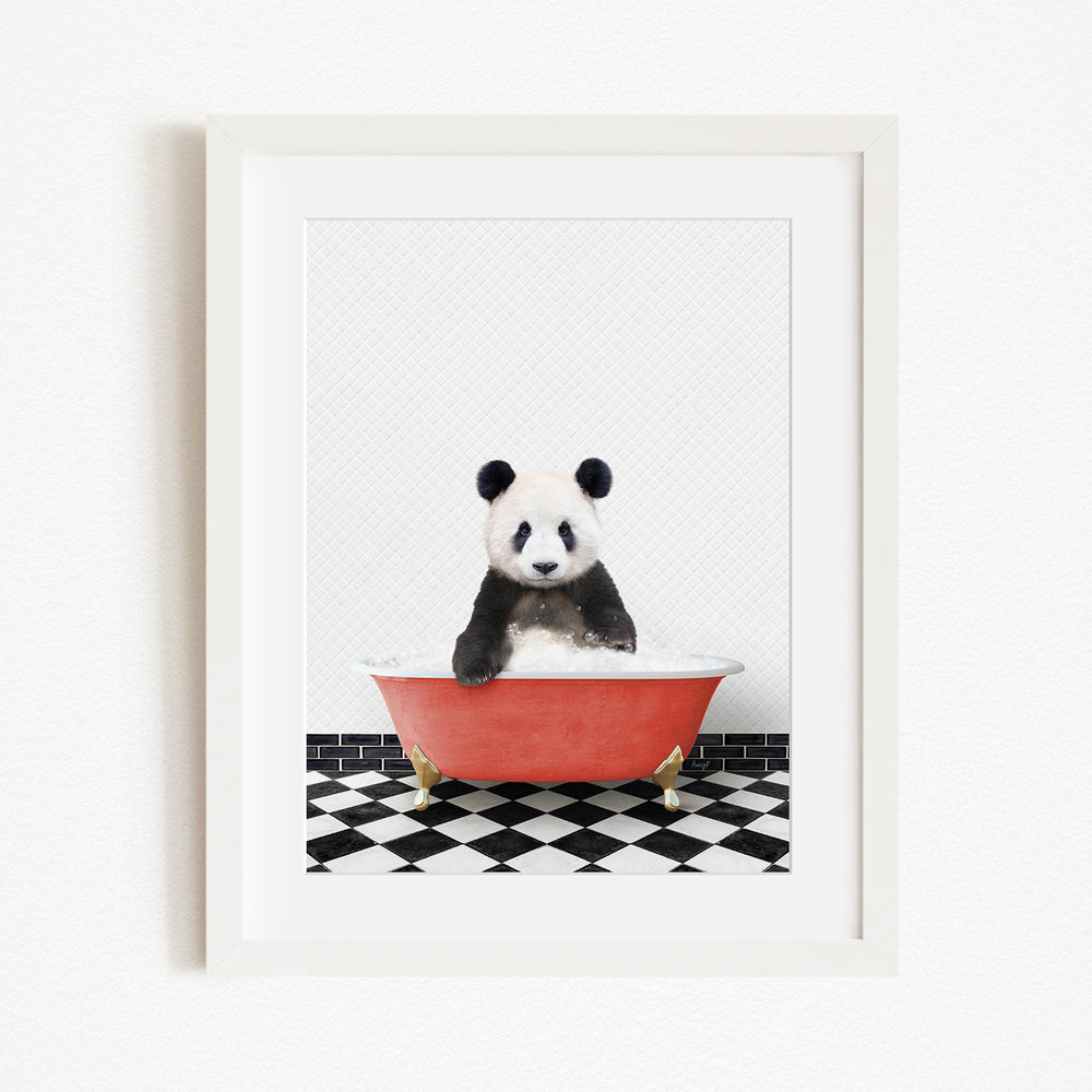 A panda bear sitting in a red bathtub on a black and white checkered floor.