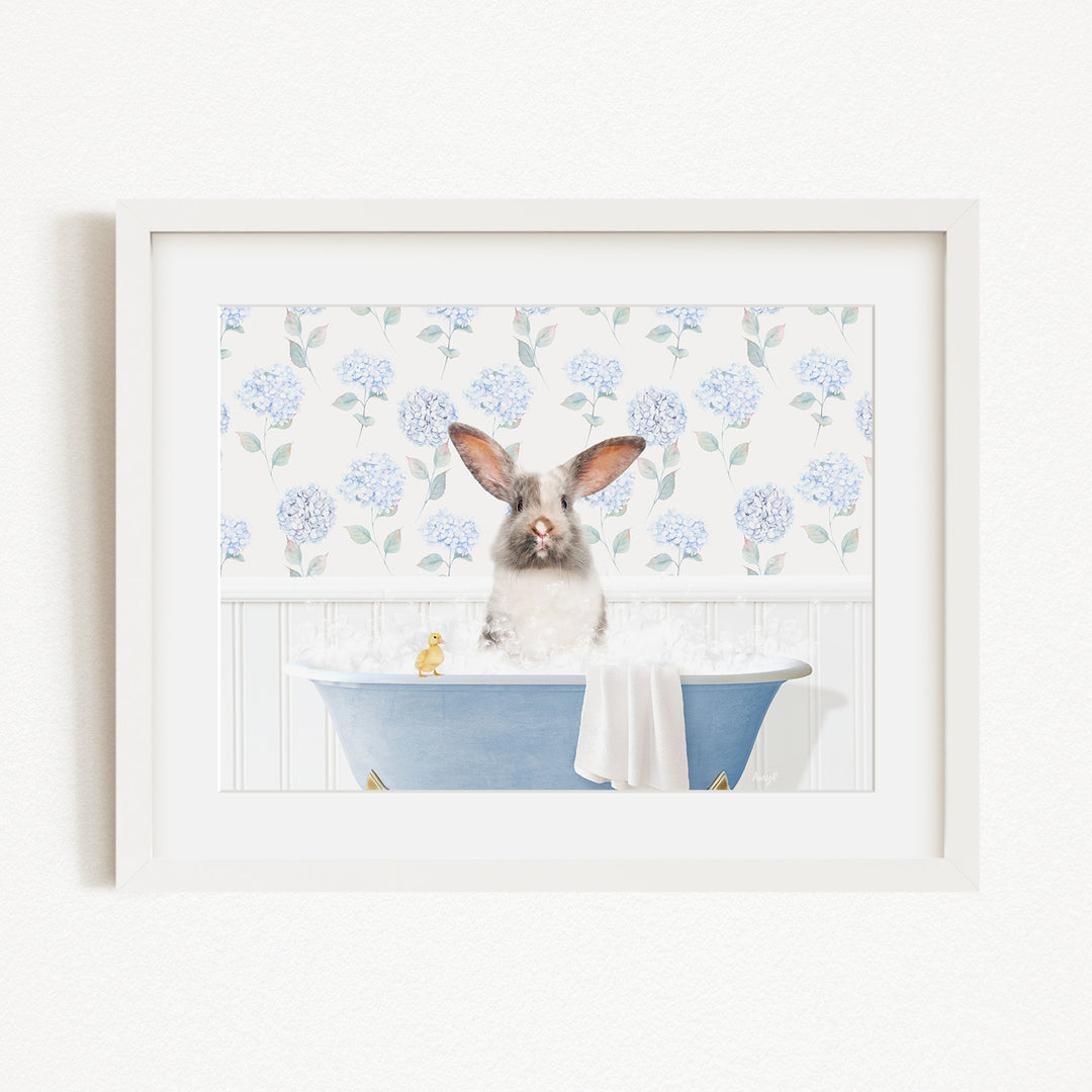 A white rabbit sitting in a blue bathtub filled with water, surrounded by a floral pattern on the wall behind it.