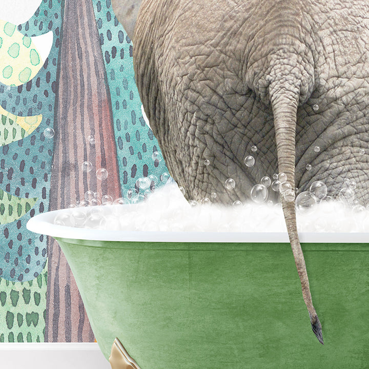 an elephant taking a bath in a green bathtub