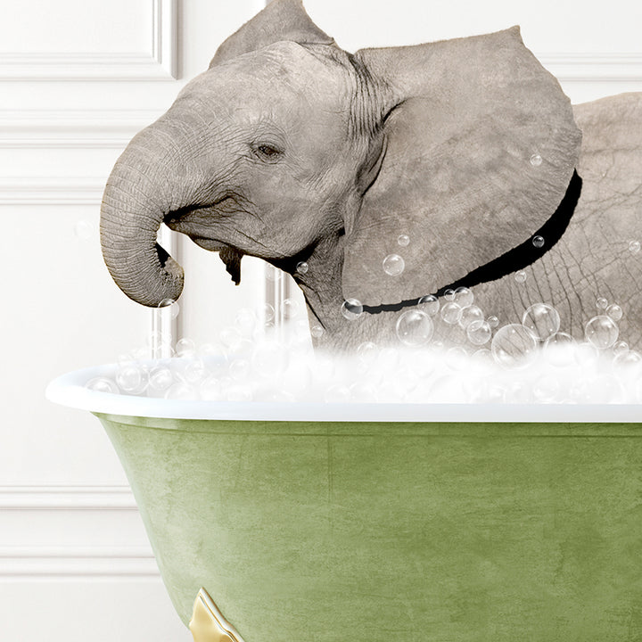 a baby elephant taking a bath in a bathtub