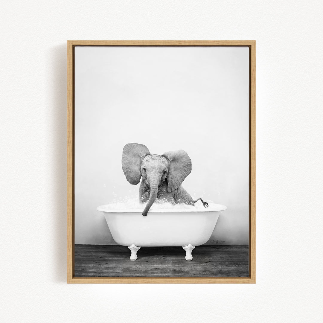 A baby elephant sitting in a bathtub filled with water, creating a playful and whimsical scene.