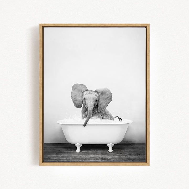 A baby elephant sitting in a bathtub filled with water, creating a playful and whimsical scene.