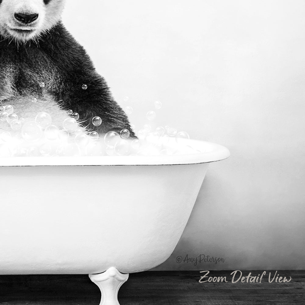 A panda bear sitting in a white bathtub filled with bubbles, creating a whimsical and playful scene.
