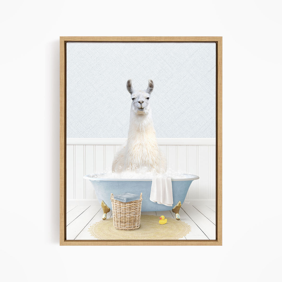 A white llama sitting in a blue bathtub filled with bubbles, surrounded by rubber ducks and a basket.