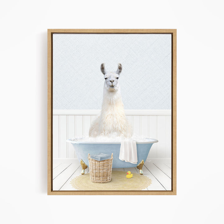 A white llama sitting in a blue bathtub filled with bubbles, surrounded by rubber ducks and a basket.