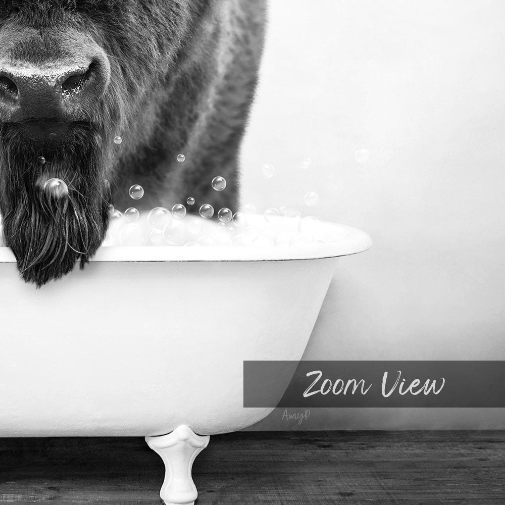 A close-up black and white image of a dog's face partially submerged in a bathtub filled with bubbles, with the word "Zoom View" written below the image.