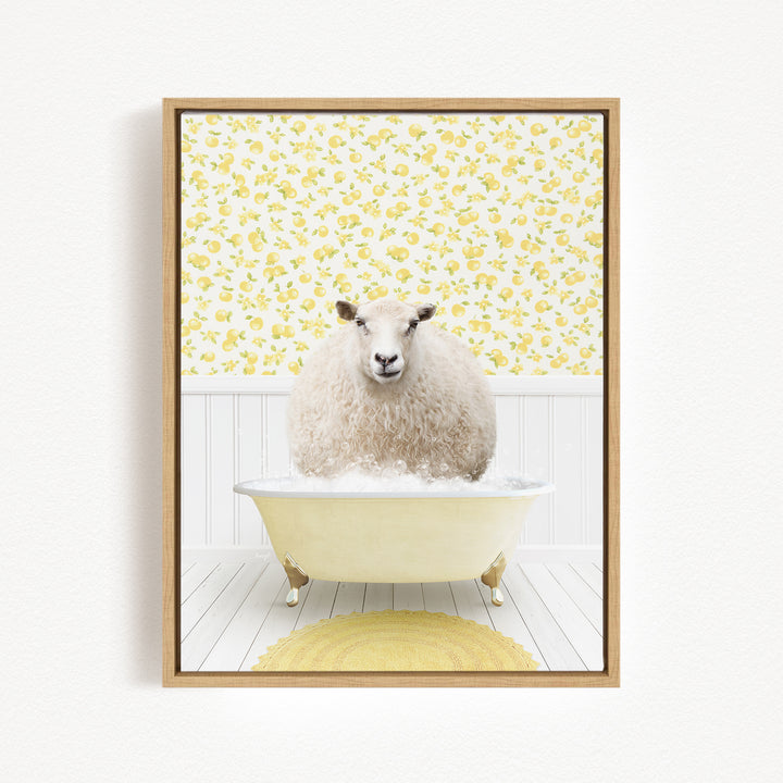 A fluffy white sheep sits in a yellow bathtub, surrounded by a yellow floral pattern on the wall behind it.