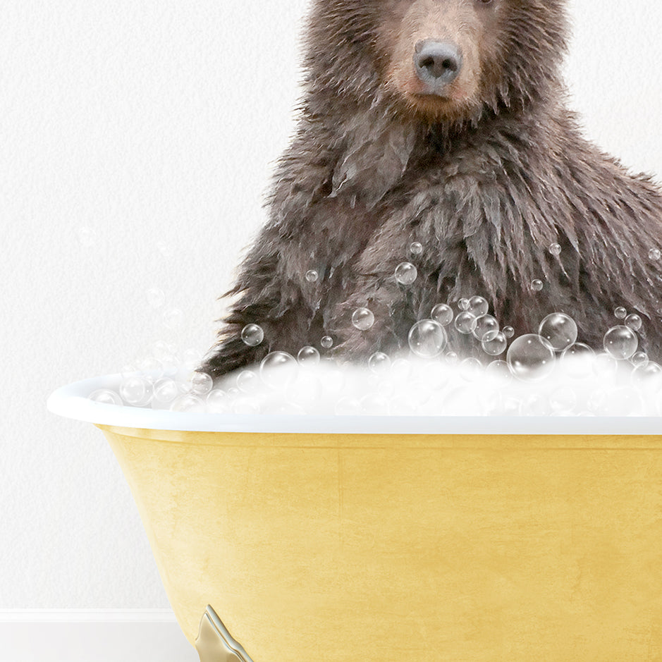 a brown bear sitting in a bathtub with bubbles