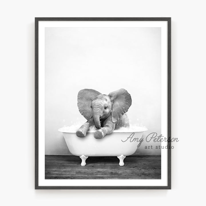 a black and white photo of an elephant in a bathtub