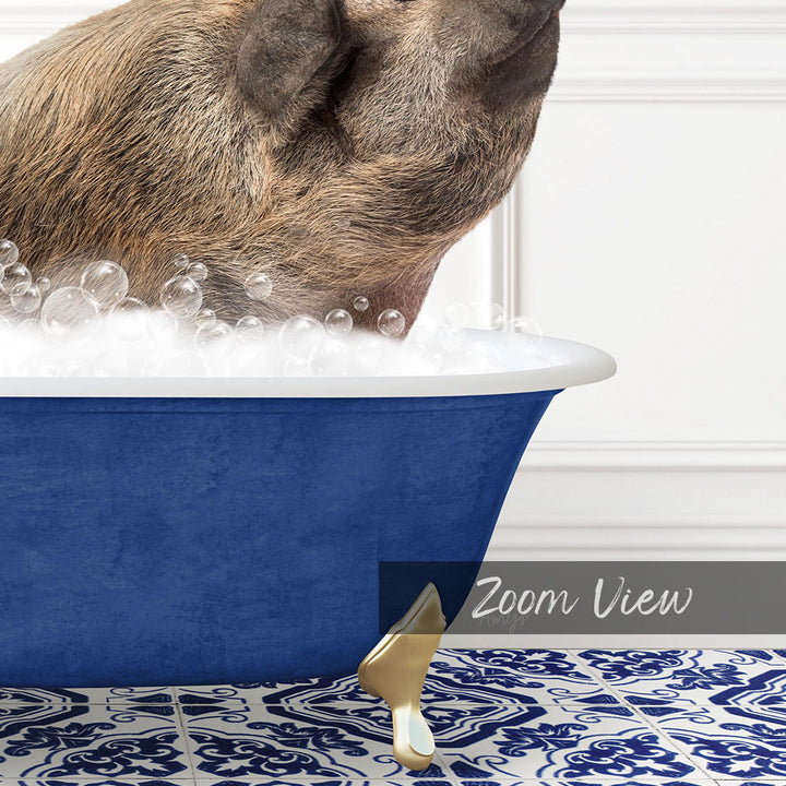 A pig is sitting in a blue bathtub filled with bubbles, with its head submerged in the water.