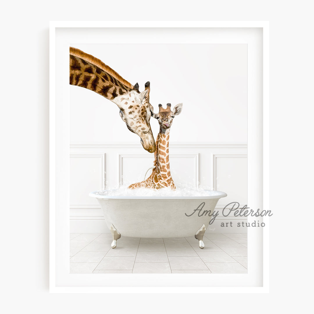 a couple of giraffe standing next to each other in a bathtub