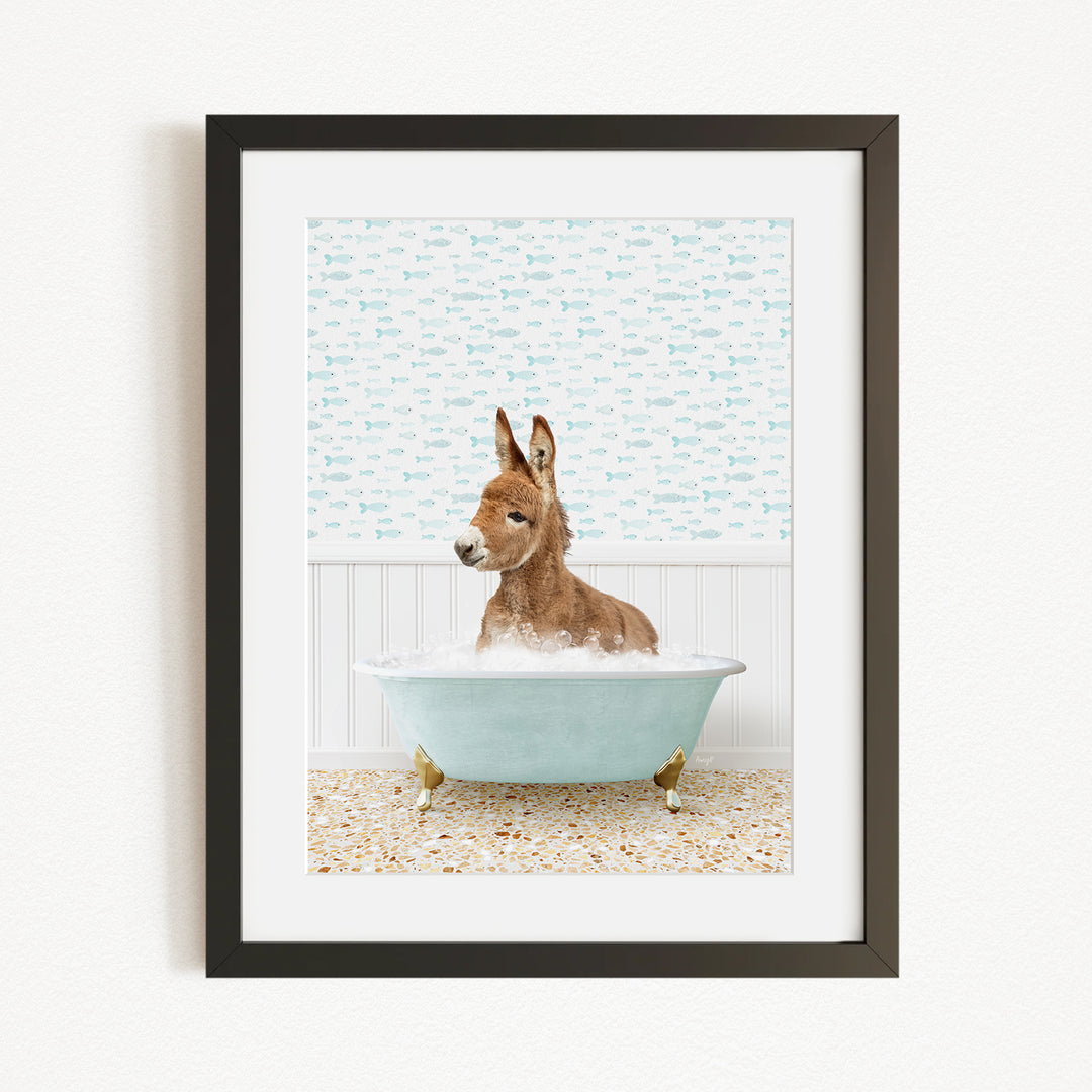 A donkey is sitting in a bathtub filled with water, surrounded by a patterned wall.