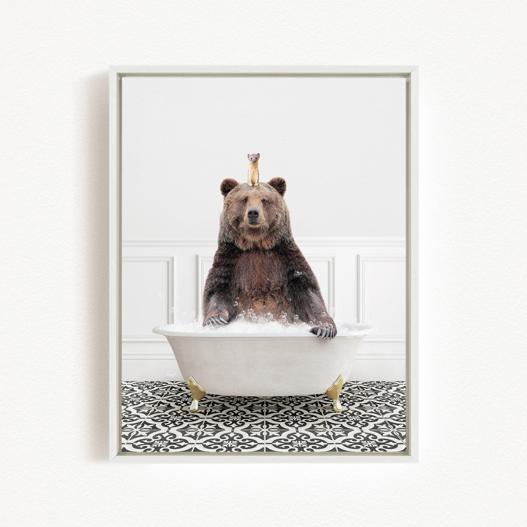A brown bear sitting in a white bathtub, with a small bird perched on its head.