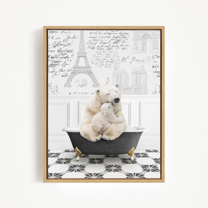A polar bear is sitting in a bathtub, with another polar bear sitting on its lap, in a bathroom setting with a Paris Eiffel Tower and other buildings visible in the background.