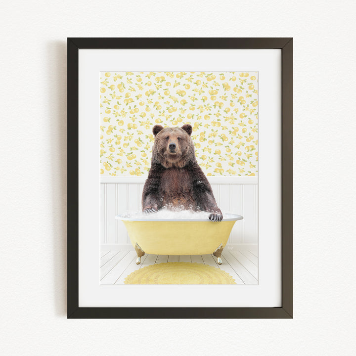 A brown bear sitting in a yellow bathtub, surrounded by a yellow floral pattern on the wall behind it.