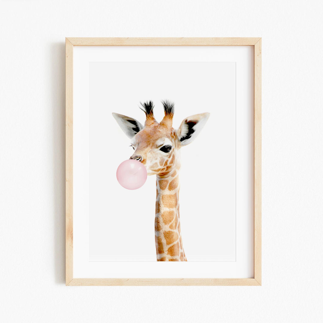 a picture of a giraffe with a bubble in its mouth
