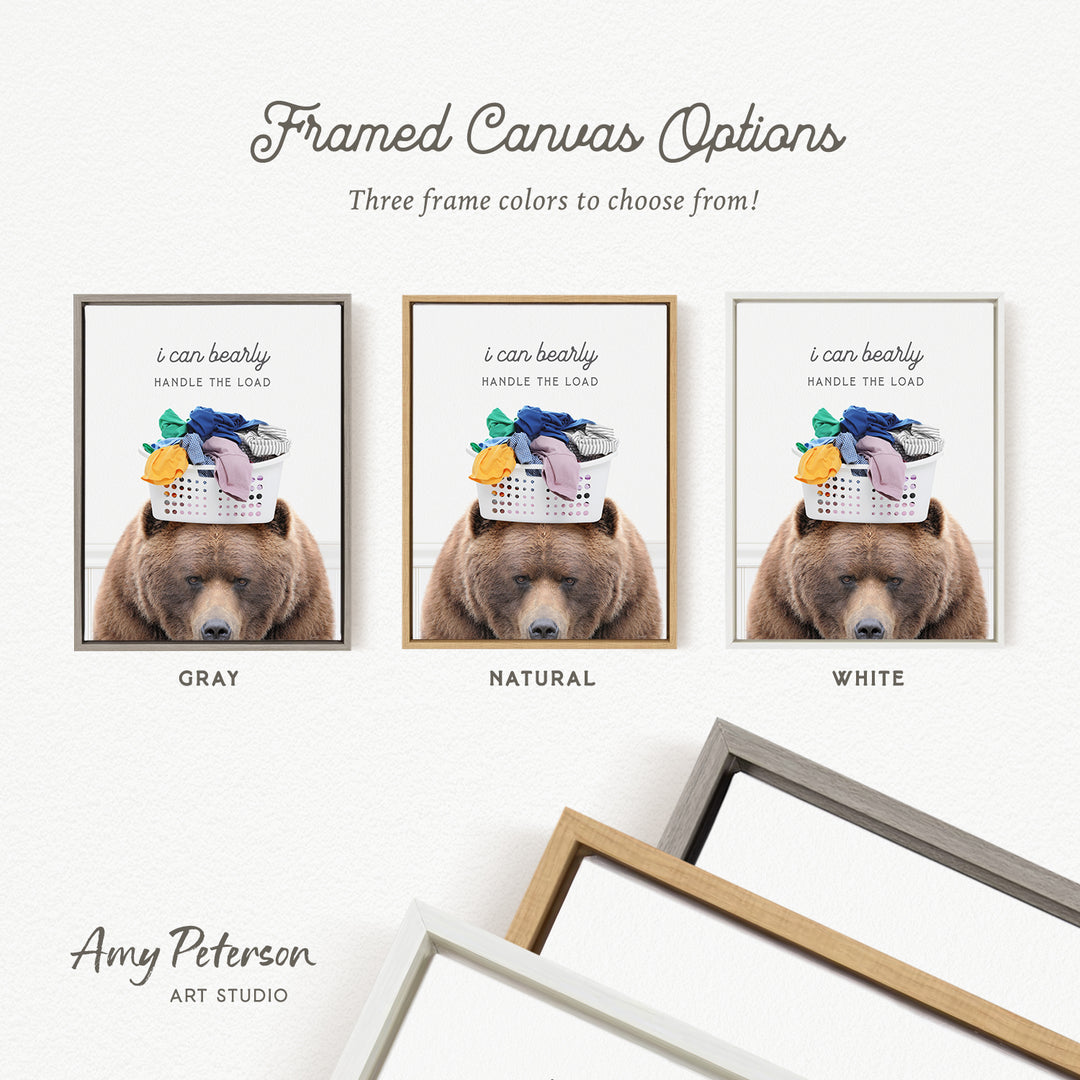 The image is a framed canvas option featuring three different color options for a bear holding laundry.