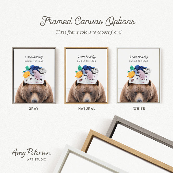 The image is a framed canvas option featuring three different color options for a bear holding laundry.