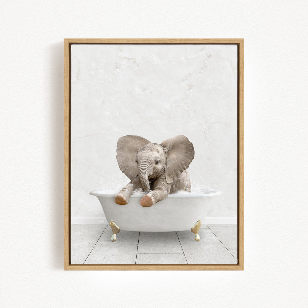 A baby elephant sitting in a white bathtub, with its trunk submerged in the water.