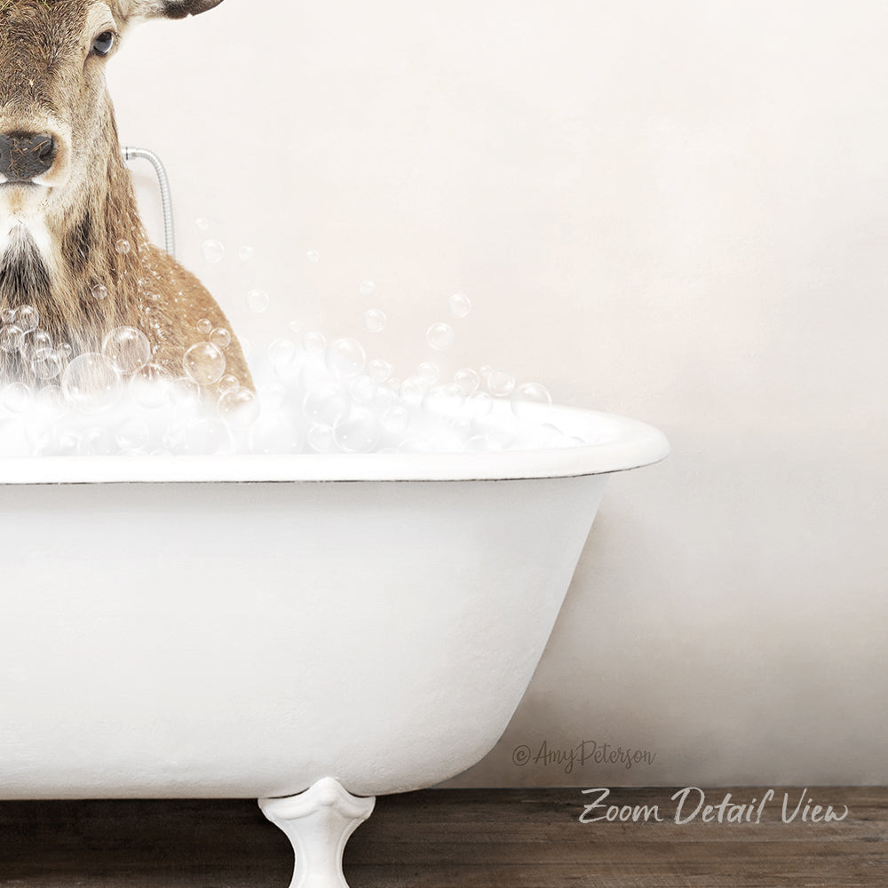 A deer is taking a bath in a white bathtub, surrounded by bubbles.