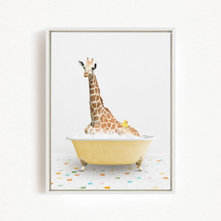A giraffe is sitting in a yellow bathtub filled with bubbles, with a yellow rubber duck floating on the water.