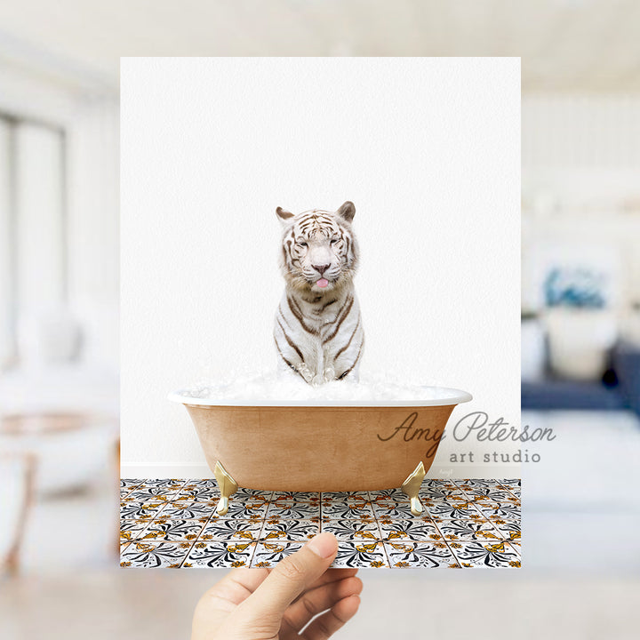 a hand holding a card with a white tiger in a bathtub