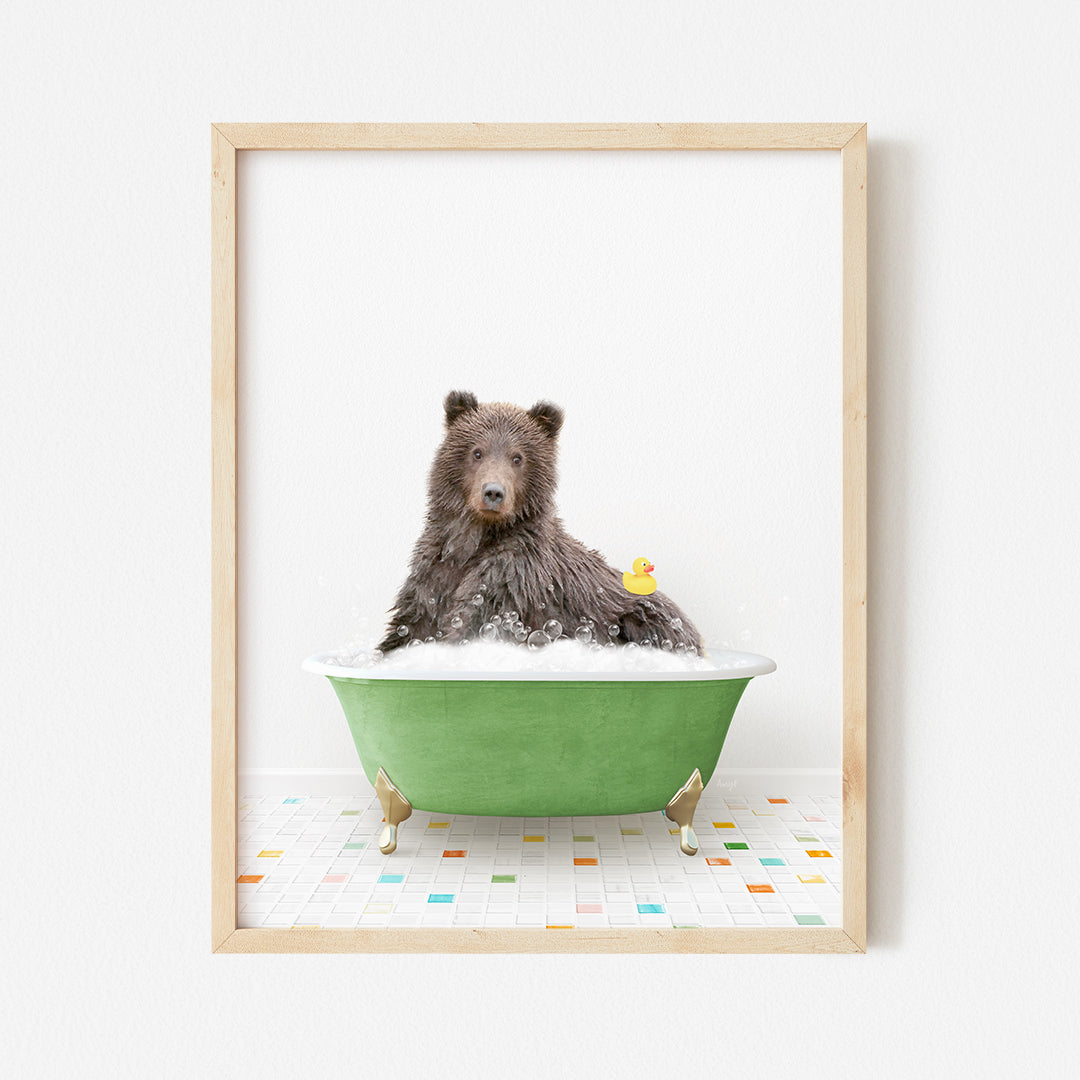 a brown bear sitting in a green bath tub